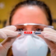 A nurse in Brazil holds a coronavirus vaccine candidate made by the Chinese company Sinovac Biotech. The trial for the vaccine is being carried out in Brazil.